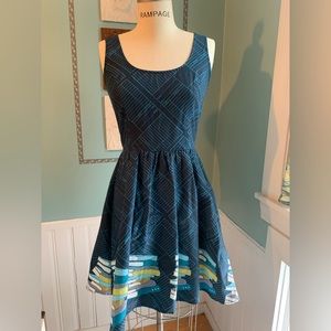Cute retro style library book dress with pockets, size small.